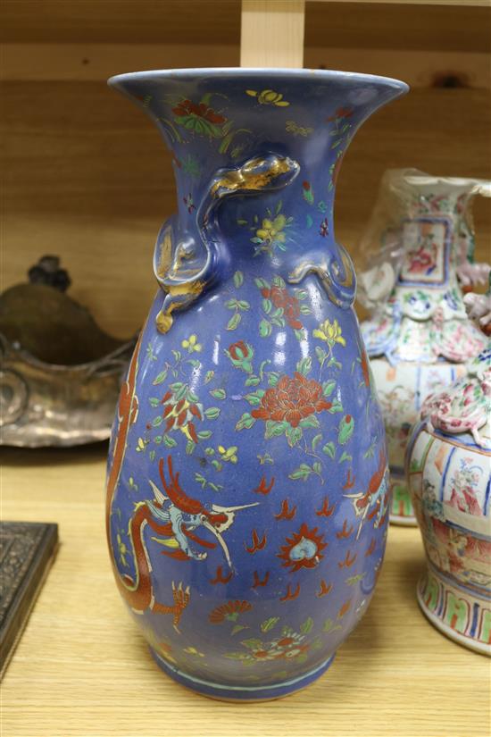 A 19th century Chinese blue ground dragon vase and a pair of famille rose vases tallest 36cm